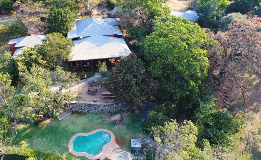 Aerial shot of Lidwala Lodge showcasing the swimming pool and beautiful garden surrounds in Ezulwini, Eswatini